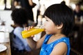 Little boy drinking orange juice Royalty Free Stock Photo