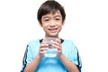 Little boy drinks water from a glass