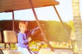 Little boy driving golf cart on beach Royalty Free Stock Photo