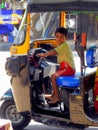 Little boy driving rickshaw in Mumbai