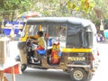 Little boy driving rickshaw in Mumbai