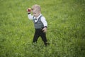 Little boy eat apple on green grass, food Royalty Free Stock Photo