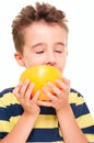 Little boy eatich grapefruit Royalty Free Stock Photo