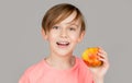 Little boy eating apple. Boy apples showing. Child with apples. Portrait of cute little kid holding an apple. Baby boy Royalty Free Stock Photo