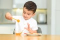 Little Boy Eating Apple With Honey. Royalty Free Stock Photo