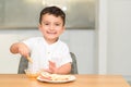 Little Boy Eating Apple With Honey. Royalty Free Stock Photo