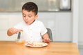 Little Boy Eating Apple With Honey. Royalty Free Stock Photo