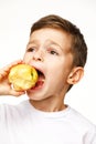 Little boy is eating apple studio shot Royalty Free Stock Photo