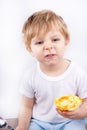 Little boy with eating cheesecake muffin. Royalty Free Stock Photo