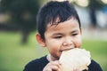 Little boy eating food fresh bread roll Royalty Free Stock Photo