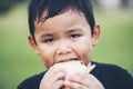 Little boy eating food fresh bread roll Royalty Free Stock Photo