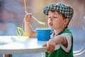 Little boy eating ice cream at indoor cafe Royalty Free Stock Photo