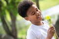 Little boy eating ice cream in park on hot summer day, enjoying sweet dessert during summer holidays. Royalty Free Stock Photo