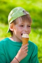 Little boy eating ice cream in the park outdoors Royalty Free Stock Photo