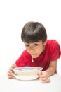 Little boy eating instant noodle on white background