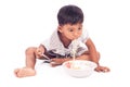 Little boy eating noodle