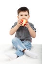 Little boy eating a red apple Royalty Free Stock Photo