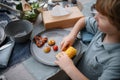 Little boy eating roasted corn and vegetables at family barbecue party in garden. Royalty Free Stock Photo