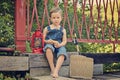 Little boy eating sandwich on bridge Royalty Free Stock Photo