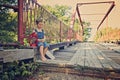 Little boy eating sandwich on bridge Royalty Free Stock Photo