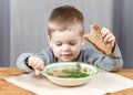 Little boy eating soup for dinner Royalty Free Stock Photo