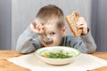 Little boy eating soup for dinner Royalty Free Stock Photo