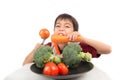 Little boy eating vegetable