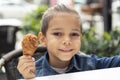 Little boy eats fried chicken