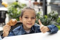 Little boy eats fried chicken