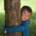 Little boy embracing a tree Royalty Free Stock Photo