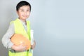 Little boy in engineering uniform with helmet and copy space Royalty Free Stock Photo