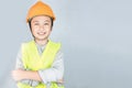 Little boy in engineering uniform with helmet and copy space Royalty Free Stock Photo