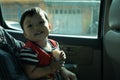 Little boy enjoy travel. Inside of a car