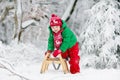 Little boy enjoying a sleigh ride. Child sledding. Toddler kid riding a sledge. Children play outdoors in snow. Kids sled in the Royalty Free Stock Photo