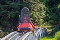 Little boy enjoying a summer fun roller alpine coaster ride Royalty Free Stock Photo