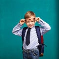 little Boy in eyeglasses with big backpack