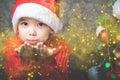 Little boy fairy blowing fairy magical glitter, stardust at Christmas Royalty Free Stock Photo