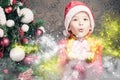 Little boy fairy blowing fairy magical glitter, stardust at Christmas Royalty Free Stock Photo