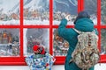 Little boy and father look Christmas shop window at the Festival