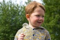 Little boy in the field of dandelions Royalty Free Stock Photo