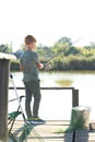 Little boy fishing alone