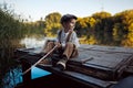 Little boy fishing at sunset