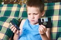 Little boy with floppy disk and audio cassette Royalty Free Stock Photo