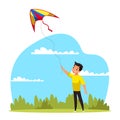 Little boy flying kite having fun in green park Royalty Free Stock Photo