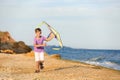 Little boy flying kite near sea Royalty Free Stock Photo