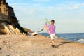 Little boy flying kite near sea Royalty Free Stock Photo