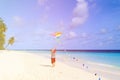 Little boy flying a kite on tropical beach Royalty Free Stock Photo