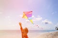 Little boy flying a kite on tropical beach Royalty Free Stock Photo