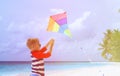 Little boy flying a kite on tropical beach Royalty Free Stock Photo