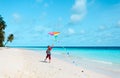 Little boy flying a kite on tropical beach Royalty Free Stock Photo